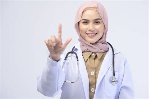 Female Muslim Doctor With Hijab Over White Background Studio Stock