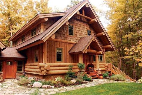 A Log Home With Lots Of Wood On The Front