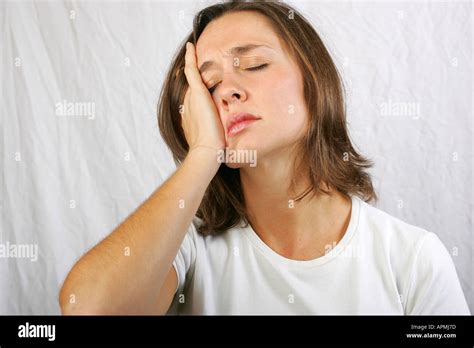 Brunette Woman Holds Her Face Looking Tired Depressed Dejected Let