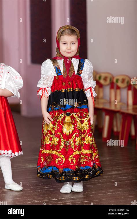 Cute Girl In Russian Traditional Clothes In Kindergarten Standing On
