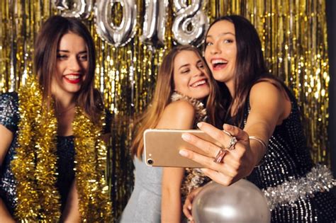 Free Photo Three Girls Taking Selfie On New Year Celebration