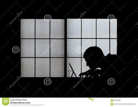 Window Silhouette Of A Creepy Computer Hacker Hunched Over