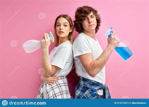Housekeeping Concept Confident Caucasian Husband And Wife With Cleaning Supplies Isolated On