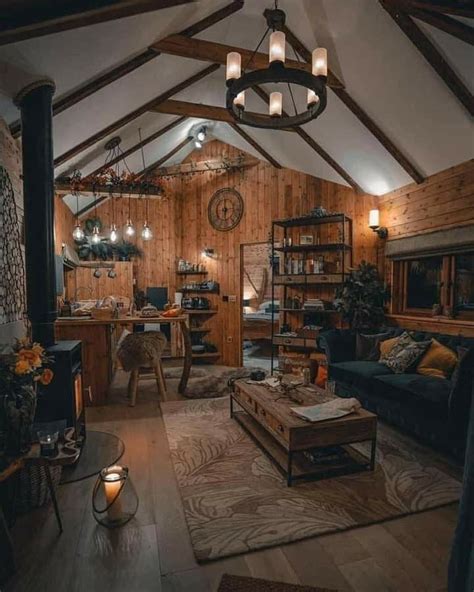 A Living Room Filled With Furniture And Lots Of Wooden Paneled Walls In An Attic