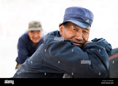 A Chinese Man Wearing A Blue Adidas Cap Stock Photo Alamy