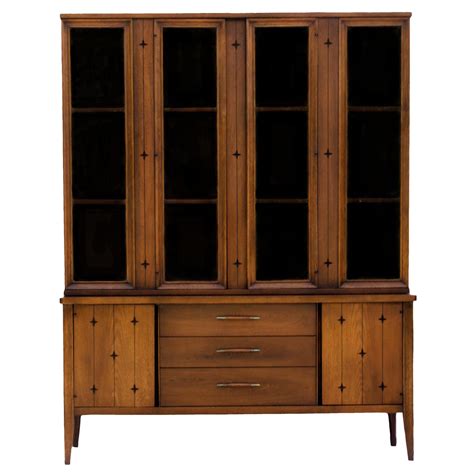 I have a large china cabinet made by bassett furniture company. Broyhill Saga China Cabinet on Credenza | Chairish