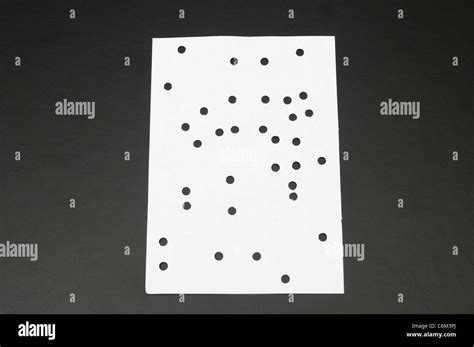 Punched Holes On White Paper Stock Photo Alamy
