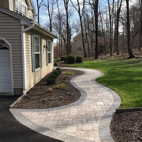 Our home had a simple walkway with cement pavers, which proved to be a hassle we finished the walkway simply by digging up the grass, adding red lava rocks, flowers, and solar lights to boost up. Cambridge paver walkway to the front door. Serving ...