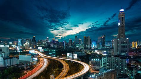 City Buildings Skyscrapers Lighting Up The Night Road Bridge Traffic