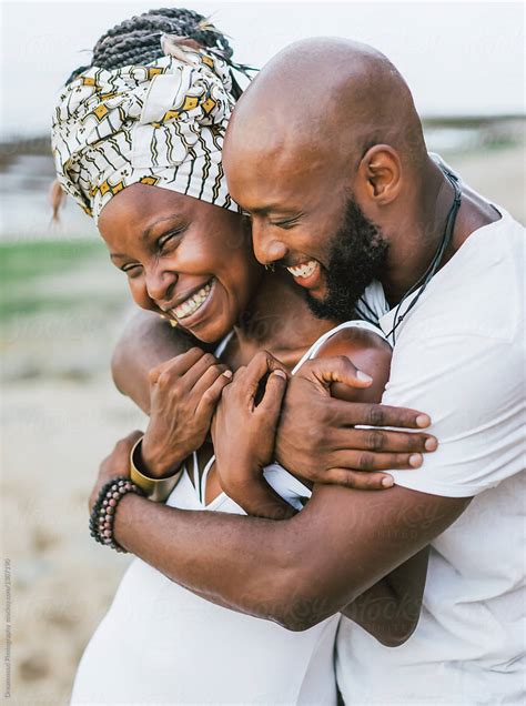 Happy Embracing Black Couple Posing By Stocksy Contributor Dreamwood Photography Stocksy