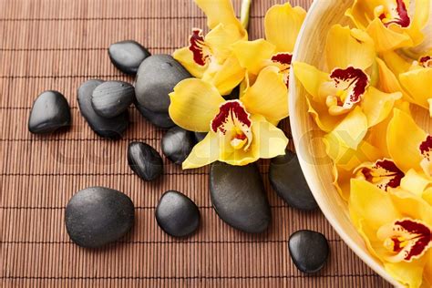 Massage Stones With Flowers On Mat Stock Image Colourbox