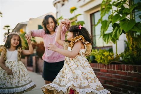 Mother Dancing With Her Daughters On The Street · Free Stock Photo