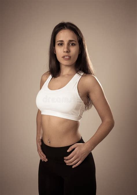 Portrait Of Sporty Beautiful Brunette Woman In Sport Clothes Looking