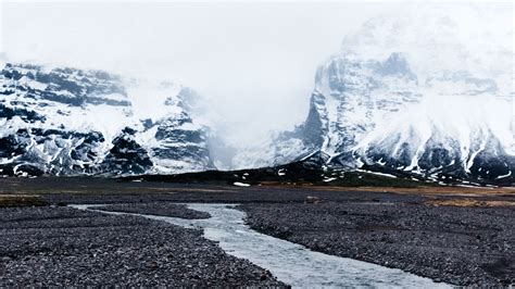 Download Wallpaper 1366x768 River Glaciers Mountains Fog Current