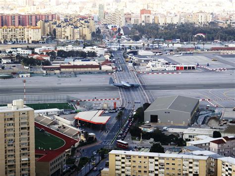 The runway is owned by the ministry of defence for use by the royal air force as raf gibraltar. An airport in Gibraltar has a busy 4-lane highway crossing ...