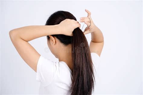 Asian Woman Tying Up Her Hair Stock Photos Free Royalty Free Stock