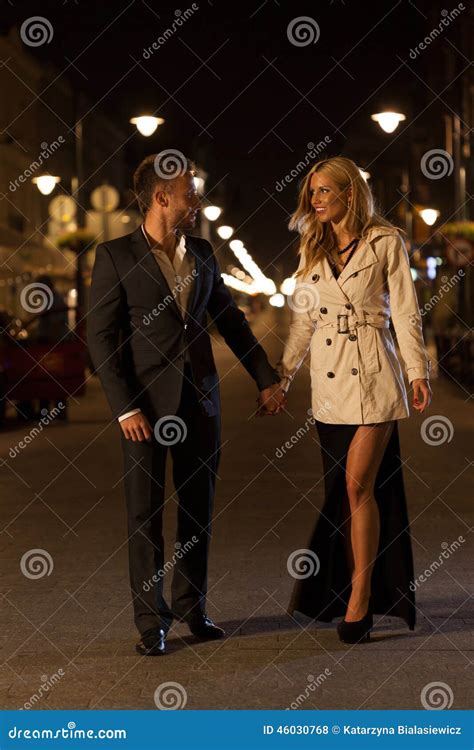 Elegant Couple On An Evening Walk Stock Photo Image Of Lights