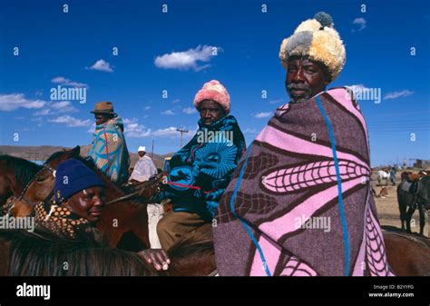 Men Wrapped In Basotho Blankets On Horseback In Rural Lesotho Stock