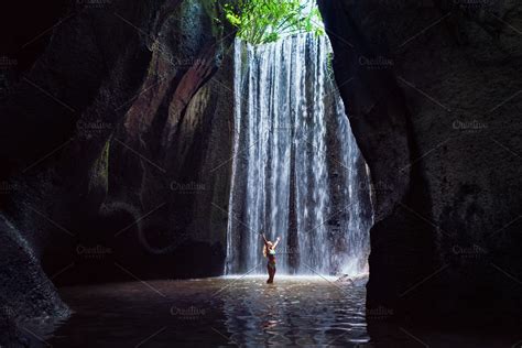 Woman Stand Under Cave Waterfall Containing Bali Travel And Indonesia