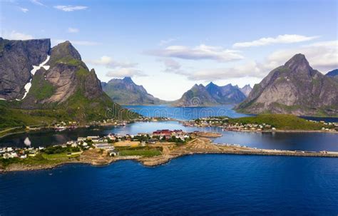 Reine Fishing Village Surrounded By High Mountains And Fjords On