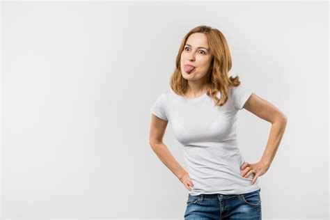 Free Photo Close Up Of A Female Woman Teasing Against White Backdrop