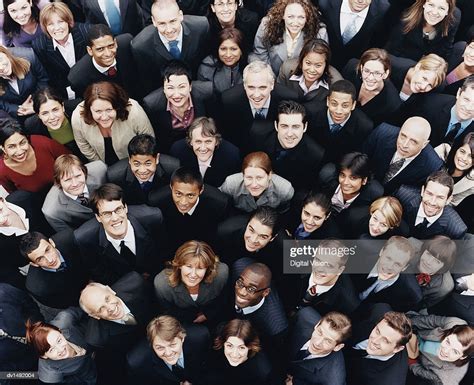 Large Group Of Business People Standing And Looking Up At Camera High