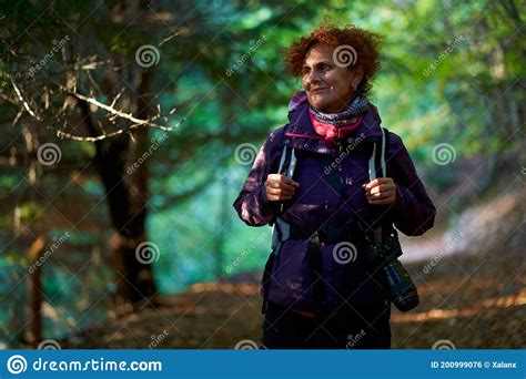 Female Nature Photographer Hiking Into The Forest Stock Photo Image