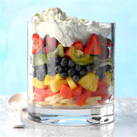 A colorful fruit salad of strawberry, kiwi, orange, raspberry, and blackberry that's drizzled with a sweet, creamy dressing infused with limoncello! Rainbow Fruit Salad Recipe | Taste of Home