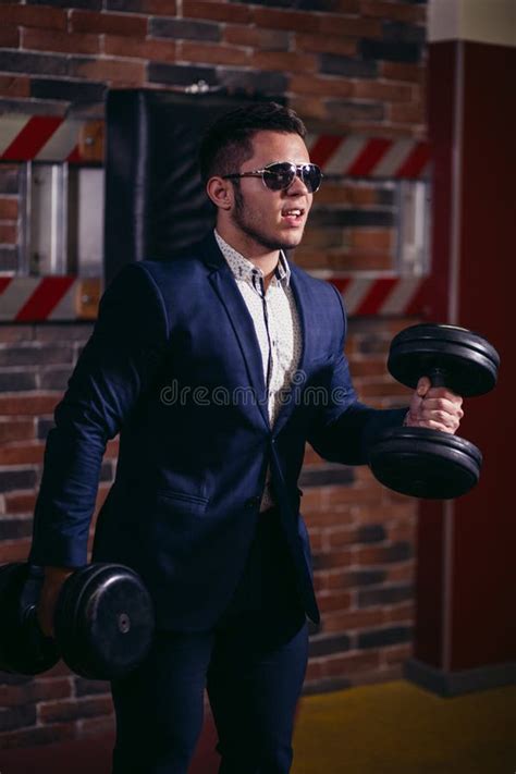 Man In Suit Lifting Weight In Gym Stock Photo Image Of Business