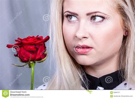 Beautiful Blonde Woman Holding Red Rose Stock Image Image Of Thinking