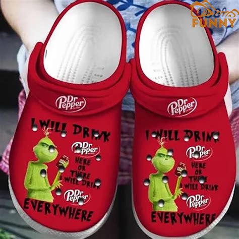 Red Background With Green Grinch Crocs Discover Comfort And Style