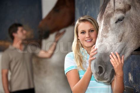 Woman Stroking Her Horse Stock Image Colourbox