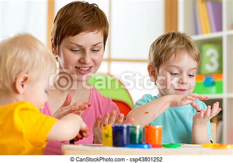 Kids With Teacher Painting In Playschool Kids Boys With Teacher