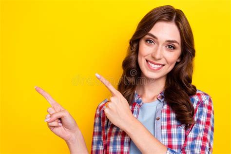 Photo Of Adorable Sweet Young Lady Wear Plaid Shirt Smiling Pointing