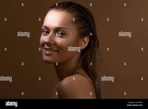 Tanned Sweet Girl With Clear Glowing Skin Health And Skin Care Portrait Of A Charming