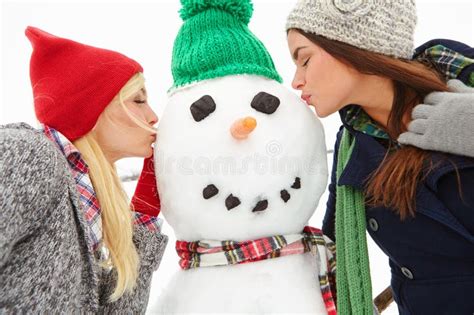 Youre The Hottest Snowman Ever Two Beautiful Young Women Kissing A Snowman Stock Image Image