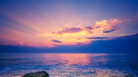 Light Purple Sky Above Beach Rock 4k Hd Nature Wallpapers Hd