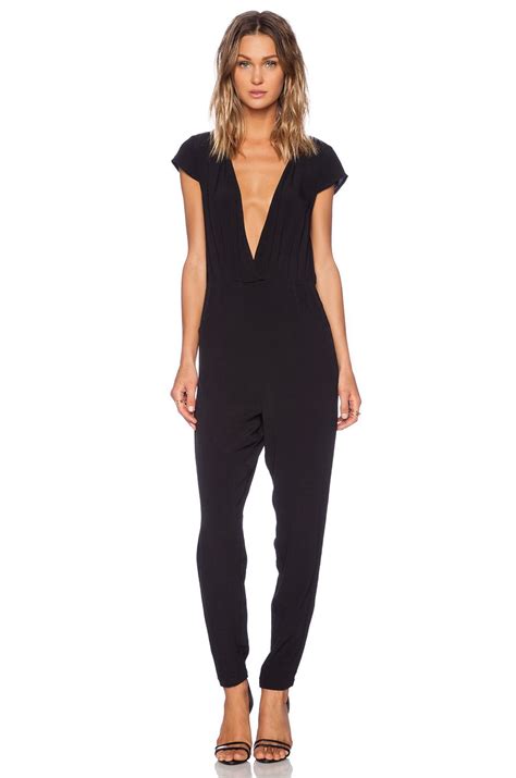 minkpink cross front jumpsuit in black from fashion revolve clothing