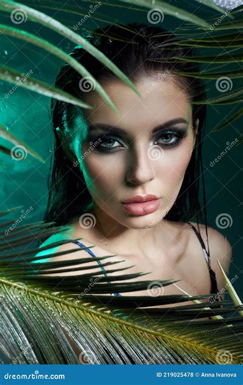 Beauty Woman In Palm Leaves Wet Makeup Tropical Portrait Girl In Green