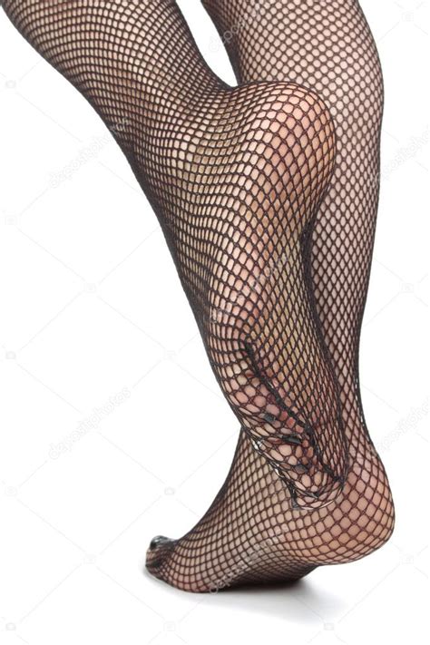Woman Feet With Fishnet Tights Over White Background Stock Photo By