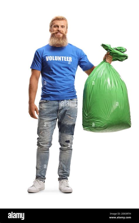 Full Length Portrait Of A Male Volunteer Holding A Green Plastic Waste