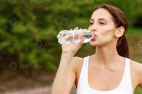 Pretty Girl Drinking Water In Park 955068 Stock Photo At Vecteezy