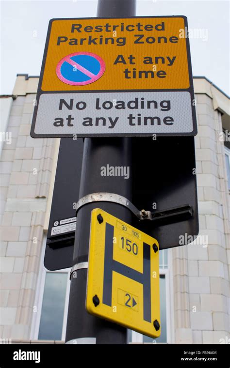 Restricted Parking Signs On Lamp Post Stock Photo Alamy