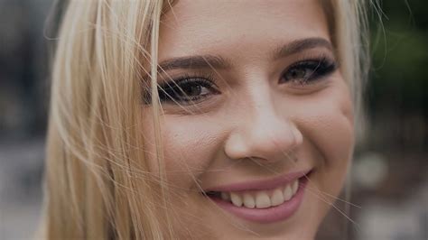 Close Up Of A Young Woman Looking At The Camera With A Smile Beautiful