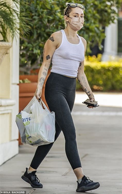 Miley Cyrus Leaves Babe To Imagination As She Goes Braless In White Tank Top For Drug Store