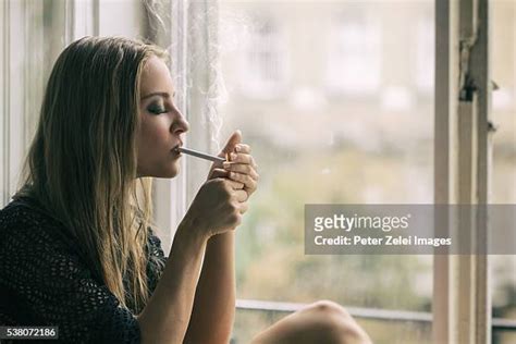 Beautiful Women Smoking Cigarette Photos And Premium High Res Pictures