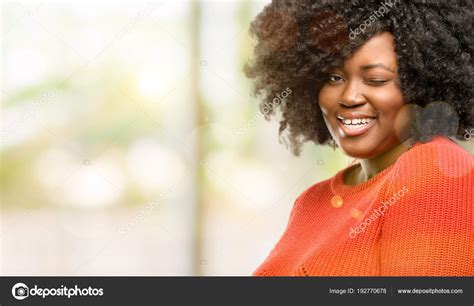 Beautiful African Woman Blinking Eyes Happy Gesture Outdoor Stock Photo