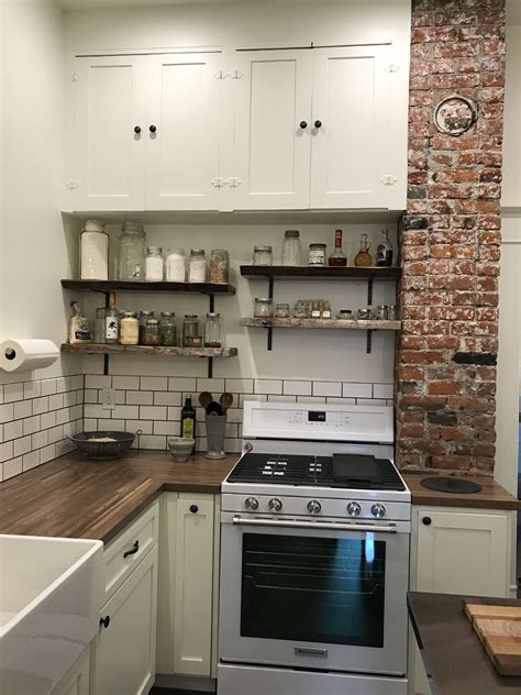 The kitchen cupboard in your home is a sacred space. Old house kitchen remodel with blue pine, raw edge shelves, exposed brick chimney and butcher ...