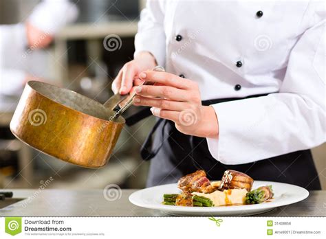 Chef In Hotel Or Restaurant Kitchen Cooking Royalty Free