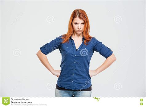 Angry Irritated Redhead Young Woman Standing With Hands On Waist Stock